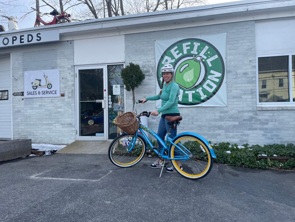 Sarah Hopkins in front of the Refill Station