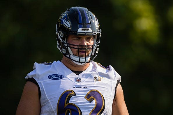 Greg Mancz #62 of the Baltimore Ravens looks on during training camp at Under Armour Performance Center Baltimore Ravens on July 28, 2021 in Owings Mills, Maryland.