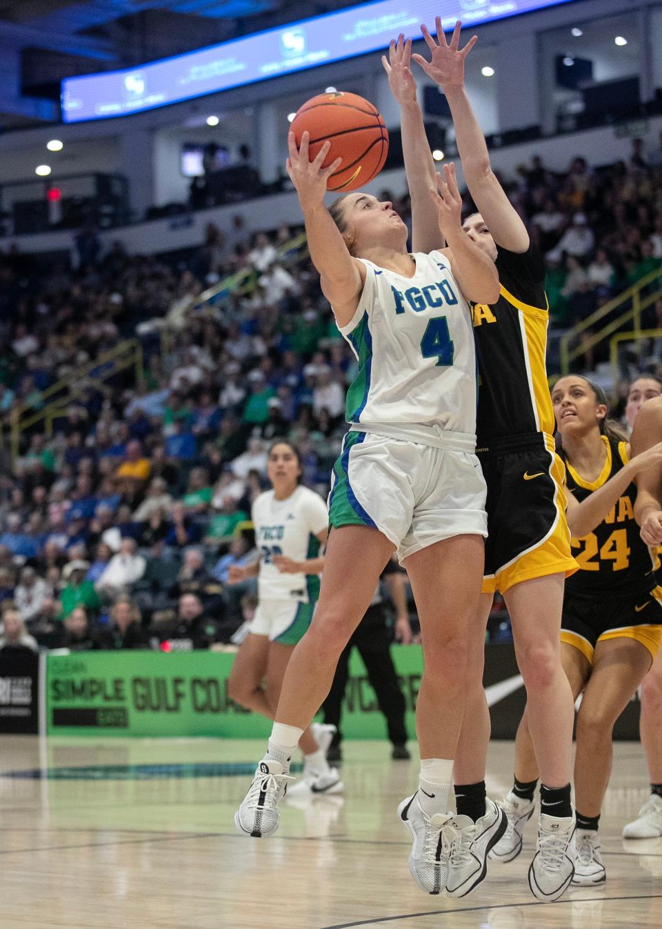 Dolly Cairns of FGCU goes up for a shot in the 2023 Women's Gulf Coast Showcase on Saturday, Nov. 25, 2023, at Hertz Arena in Estero.