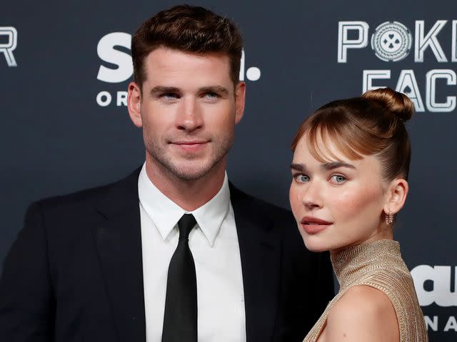 <p>Lisa Maree Williams/Getty</p> Liam Hemsworth and Gabriella Brooks in 2022