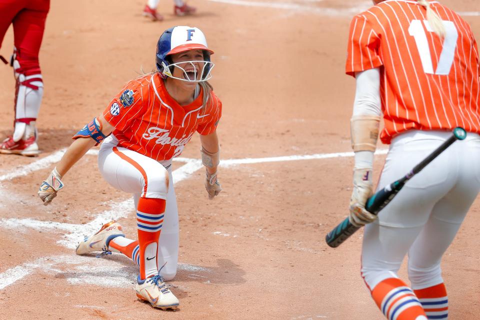 Florida outfielder Kendra Falby (27) celebrates scoring an inside-the-park home run in the second inning of a 9-3 win against Oklahoma in the Women's College World Series semifinals Monday at Devon Park.