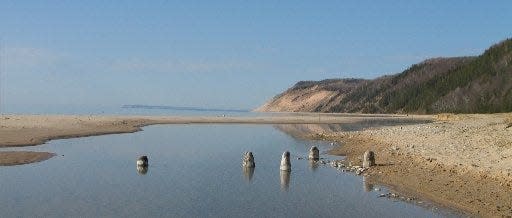 The Sleeping Bear Dunes National Lakeshore is famous for its 460-foot-high sand dunes, but its beaches on Lake Michigan are another big attraction for summer tourists. The Esch Road Beach provides a sweeping view of Empire Bluffs.