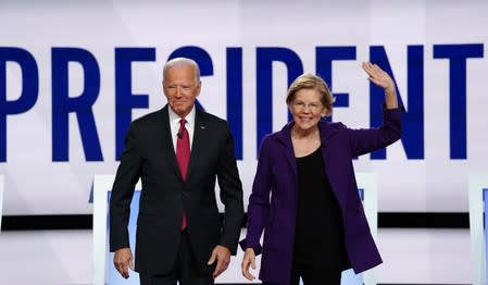 Democratic presidential candidates Biden and Warren pose together at the start of the fourth U.S. Democratic presidential candidates 2020 election debate at Otterbein University in Westerville, Ohio U.S.