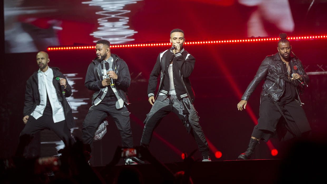 BOURNEMOUTH, ENGLAND - NOVEMBER 09: (EDITORIAL USE ONLY) Marvin Humes, JB Gill, Aston Merrygold and Oritsé Williams of JLS perform at BIC on November 09, 2021 in Bournemouth, England. (Photo by Mark Holloway/Redferns)