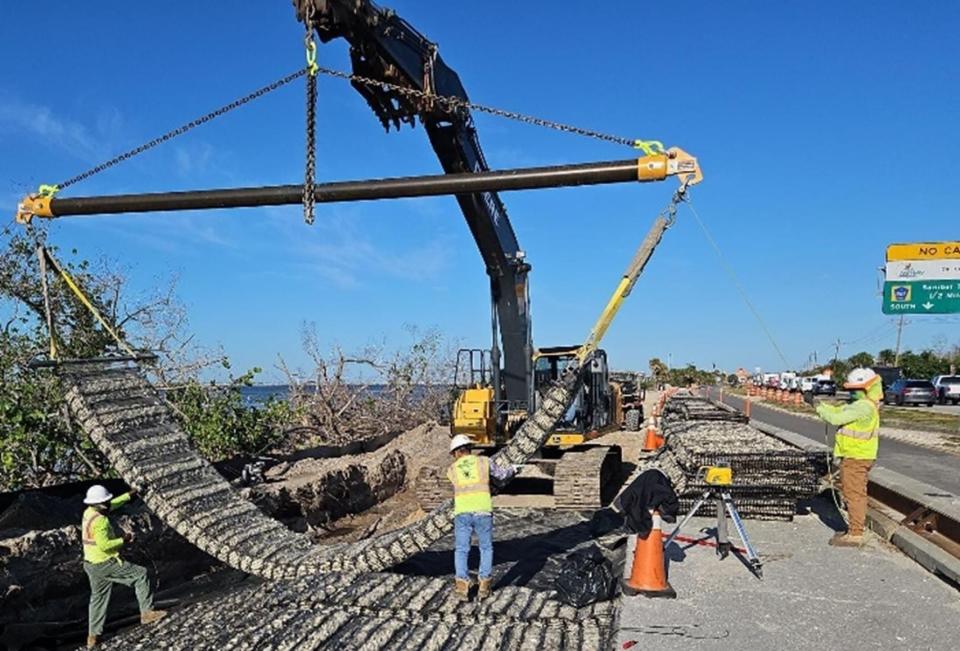 A marine mattress being installed along the Sanibel causeway.