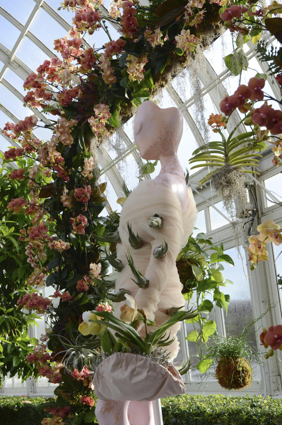 A fashion-creation inspired by nature from Collina Strada designed by Hillary Taymour in "The Orchid Show: Florals in Fashion" at The New York Botanical Garden, Saturday, Feb. 17, 2024, in the Bronx borough of New York. The show runs until April 21, 2024. (AP Photo/Pamela Hassell)