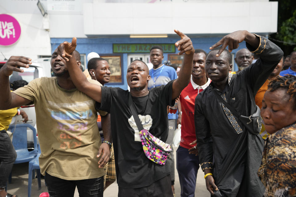 People celebrates after Eeectoral officials announce a result from of the polling station in Lagos, Nigeria, Saturday, March 18, 2023. Millions of Nigerians are headed back to the polls Saturday as Africa's most populous nation holds gubernatorial elections amid tensions after last month's disputed presidential vote. New governors are being chosen for 28 of Nigeria's 36 states as the opposition continues to reject the victory of President-elect Bola Tinubu from the West African nation's ruling party. (AP Photo/Sunday Alamba)