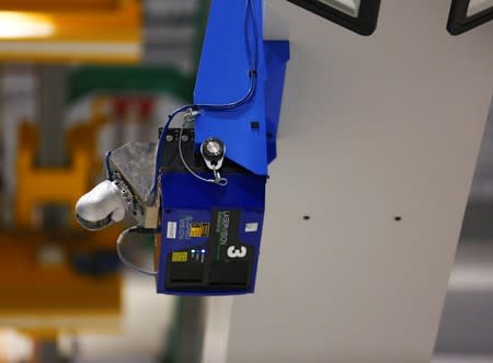 An automatic quality control machine that scans the 777X spar for defects in carbon fiber is seen during a media tour of the Boeing 777X at the Boeing production facility in Everett