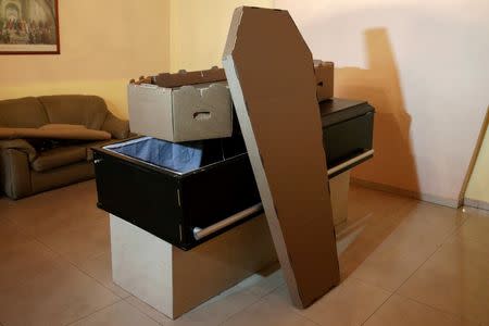 A cardboard coffin is seen at a mortuary in Valencia, in the state of Carabobo, Venezuela August 25, 2016. Picture taken August 25, 2016. REUTERS/Marco Bello