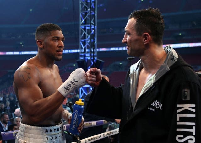 Anthony Joshua, left, bumps fists with Wladimir Klitschko after their world title bout