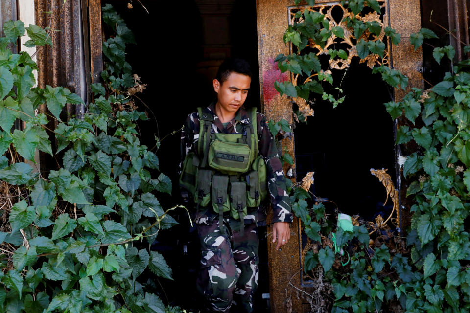 A soldier walks out of a destroyed structure at the most affected war-torn area of Marawi City, Lanao del Sur province, Philippines. (Photo: Eloisa Lopez/Reuters)