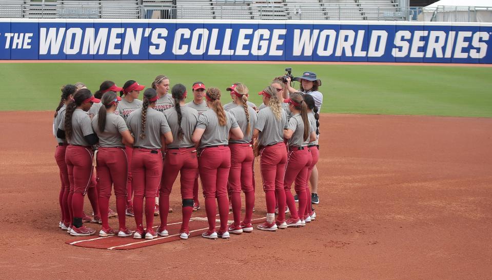 Oklahoma players gather during a practice for the Women's College World Series at USA Softball Hall of Fame Stadium in Oklahoma City, Wednesday, May 31, 2023. 