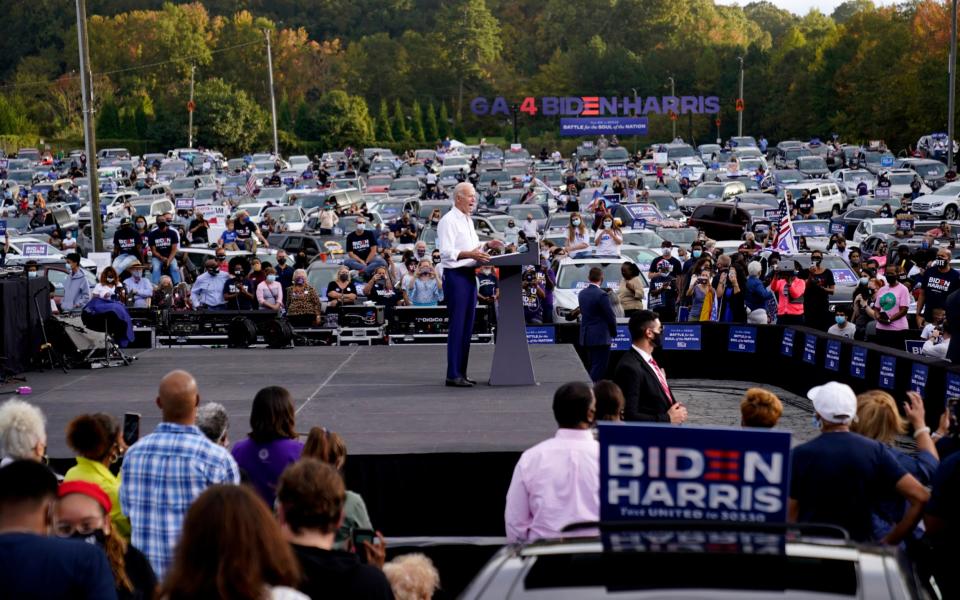 Joe Biden on the campaign trail in Georgia on Tuesday - AP