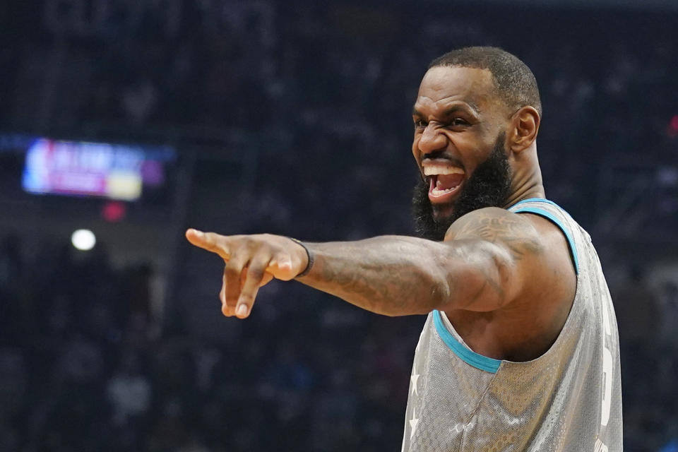 Los Angeles Lakers' LeBron James jokes with fans during the NBA All-Star game in Cleveland, Sunday, Feb. 20, 2022. (AP Photo/Charles Krupa)