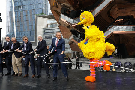 Sesame Street's Big Bird, Stephen Ross, chairman of the Related Companies and others participate in the grand opening of the The Hudson Yards development, a residential, commercial, and retail space, and a large public art sculpture called 'The Vessel,' on Manhattan's West side in New York City, New York, U.S., March 15, 2019. REUTERS/Brendan McDermid