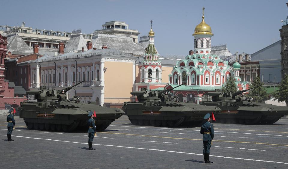Russian army tanks roll toward Red Square during the Victory Day military parade marking the 75th anniversary of the Nazi defeat in Moscow, Russia, Wednesday, June 24, 2020. The Victory Day parade normally is held on May 9, the nation's most important secular holiday, but this year it was postponed due to the coronavirus pandemic. (AP Photo/Pavel Golovkin, Pool)