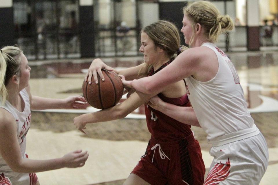 Ballinger's Jessa Battle tries to contain a loose ball against Holliday defenders Dec. 27,. Battle is averaging more than five points per game in her first varsity season.