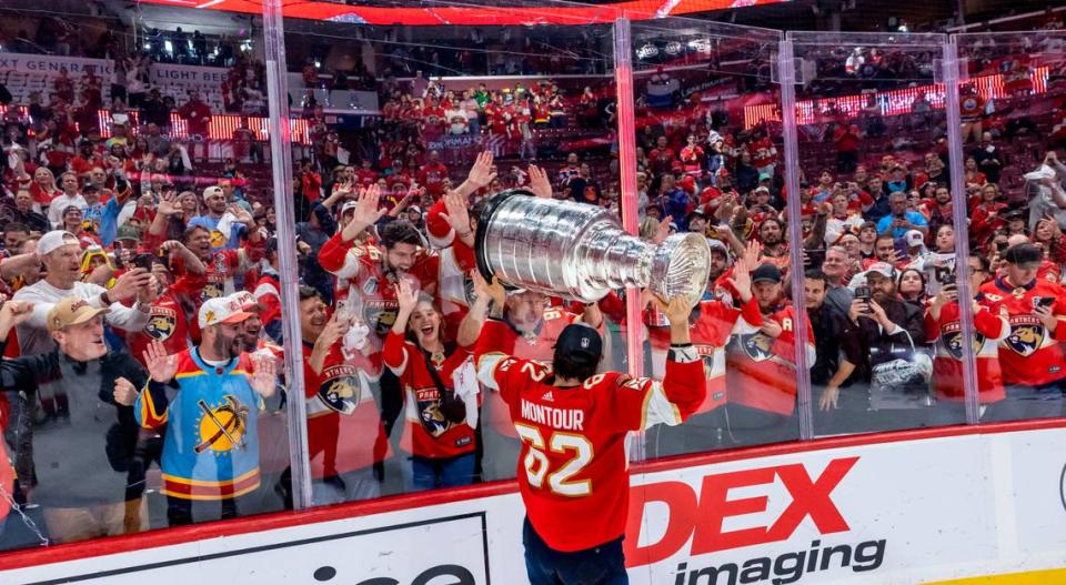 Sunrise, Florida, June 24, 2024 - Florida Panthers defenseman Brandon Montour (62) shows the Stanley Cup to Panthers fans during the celebration following their victory over the Edmonton Oilers.