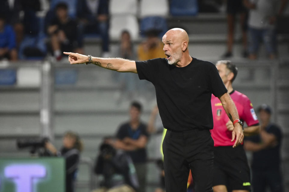 Milan's coach Stefano Pioli shouts instructions to his players during the Serie A soccer match between Sassuolo and Milan at Mapei Stadium, Reggio Emilia, Italy, Tuesday Aug. 30, 2022. (Massimo Paolone/LaPresse via AP)