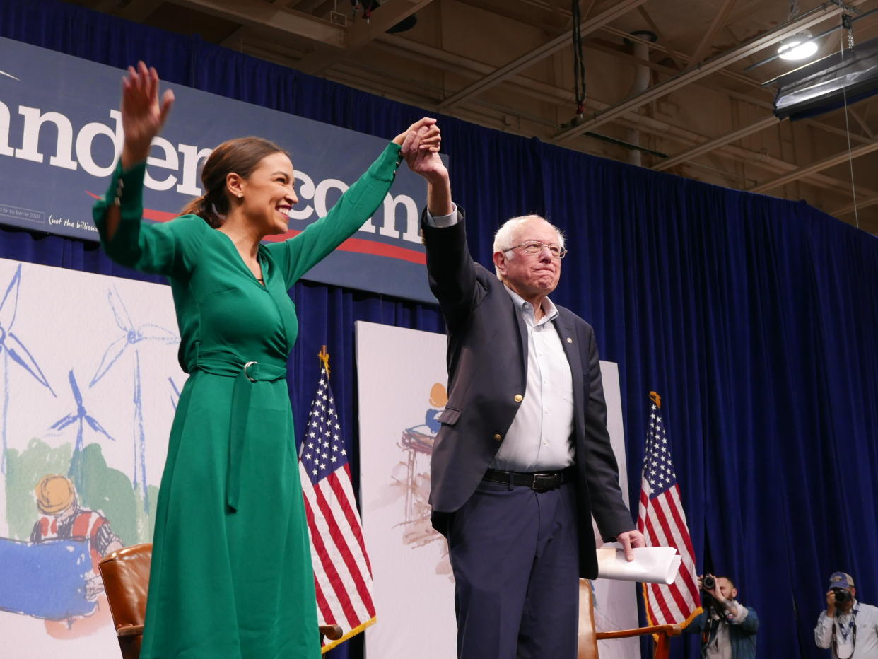 U.S. Rep. Alexandria Ocasio-Cortez (D-NY) is joined on stage by Democratic Presidential candidate Bernie Sanders (I-VT) during the Climate Crisis Summit at Drake University on Nov. 9, 2019 in Des Moines, Iowa. (Photo: Hunter Walker/Yahoo News)