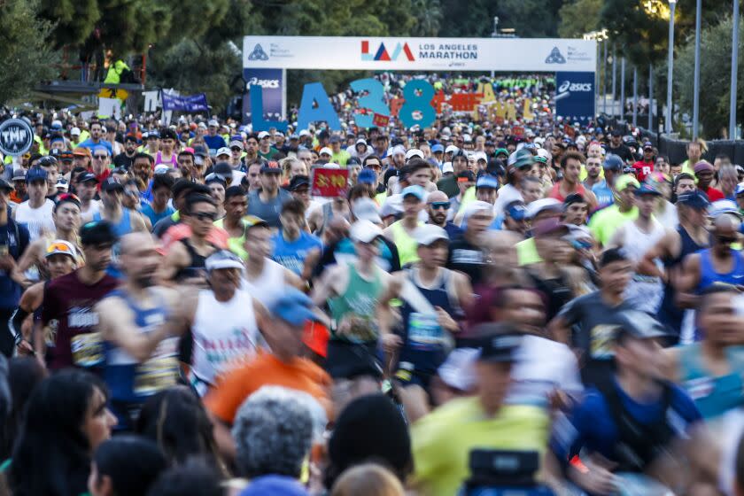 Runners start the 38th LA Marathon at Dodgers Stadium in Los Angeles, Sunday, March 19, 2023. (Photo by Ringo Chiu / For The Times)