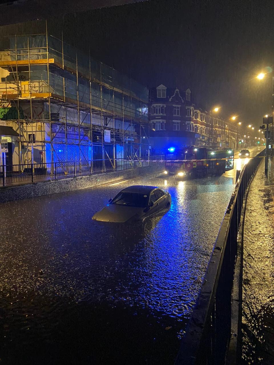 A car submerged in floodwater in Wallington, Sutton, south London, in the early hours of Monday (London Fire Brigade)