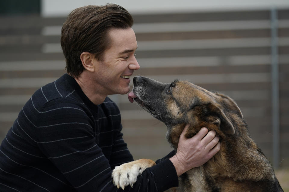 Actor Tom Pelphrey poses with his dog Blue at his home in Austin, Texas, on March 11, 2022, to promote his new Amazon Prime series "Outer Range," premiering April 15. (AP Photo/Eric Gay)