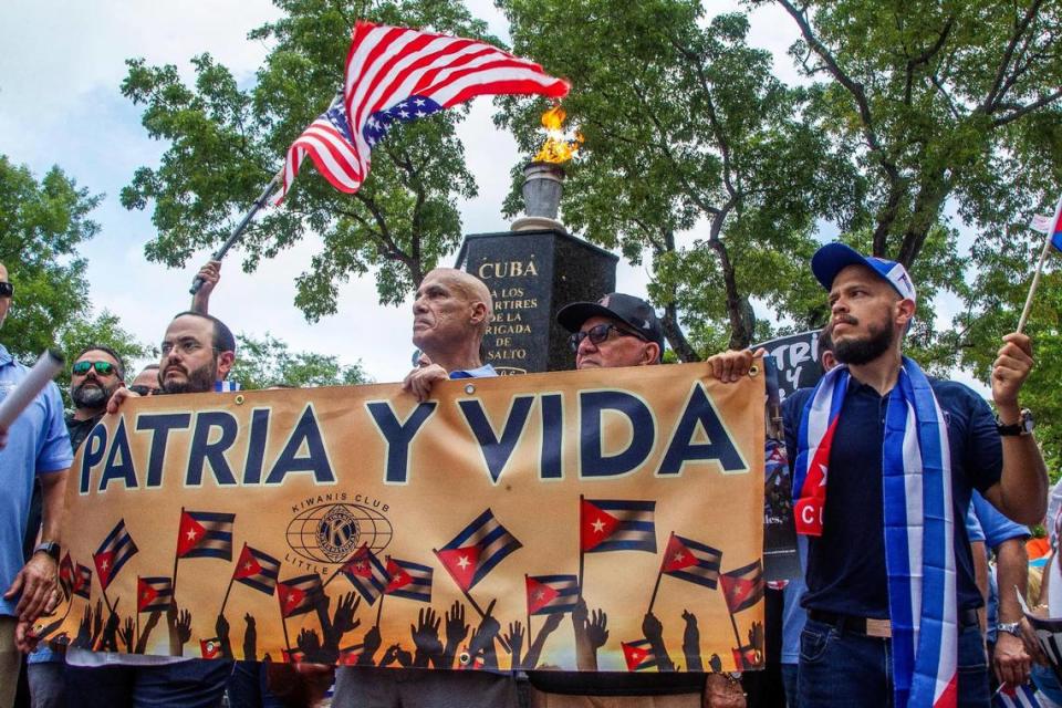 Cuban exiles stop at the Bay of Pigs Monument as they joined a march called by the Kiwanis Club of Little Havana along Southwest Eighth Street to show solidarity and support for the Cuban people asking for freedom and the end of 62 years of an oppressive authoritarian regime on the island, on July Friday 23, 2021.