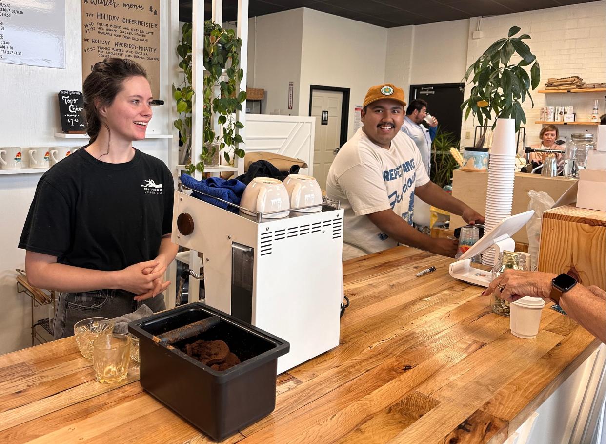 A customer pays for a cup of coffee at Driftwood Coffee at 4703 S. Alameda St. as Ashley Medina, left and Jordan Medina work the counter during the business' Shop Small Crawl pop-up market event for Small Business Saturday on Saturday, Nov. 25, 2023 in Corpus Christi.