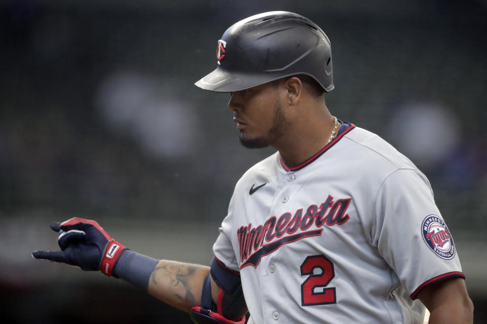 Minnesota Twins' Luis Arraez gestures after hitting an RBI single during the fourth inning of an Opening Day baseball game against the Milwaukee Brewers Thursday, April 1, 2021, in Milwaukee. (AP Photo/Aaron Gash)