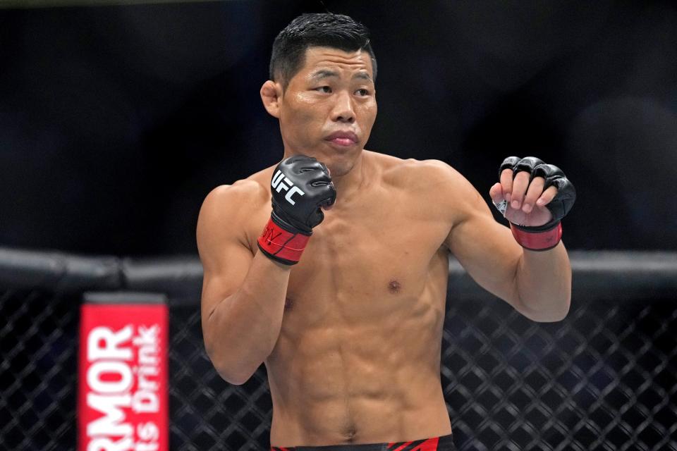 September 10, 2022; Las Vegas, Nevada, USA; Li Jingliang (red gloves) fights Daniel Rodriguez (blue gloves) during UFC 279 at T-Mobile Arena. Mandatory Credit: Joe Camporeale-USA TODAY Sports