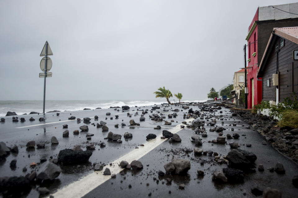 <p>Rocks lay swept by strong waves onto a road in Le Carbet, on the French Caribbean island of Martinique, after it was hit by Hurricane Maria, on Sept. 19, 2017. (Photo: Lionel Chamoiseau/AFP/Getty Images) </p>