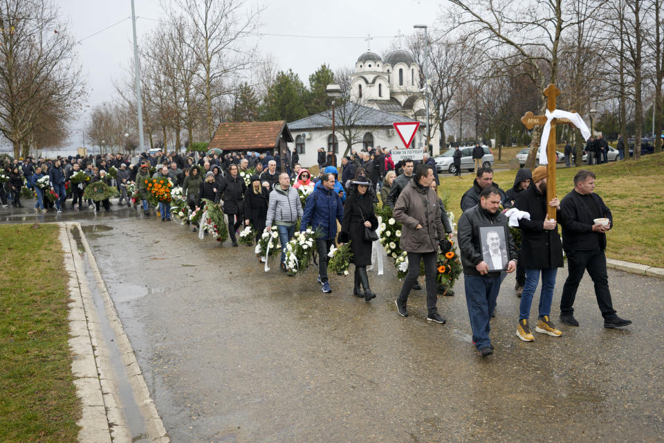 People attend the funeral of late Golden State Warriors assistant coach Dejan Milojevic in Belgrade, Serbia, Monday, Feb. 12, 2024. Milojevic, 46, died on Jan. 17, in Salt Lake City after heart attack. (AP Photo/Darko Vojinovic)