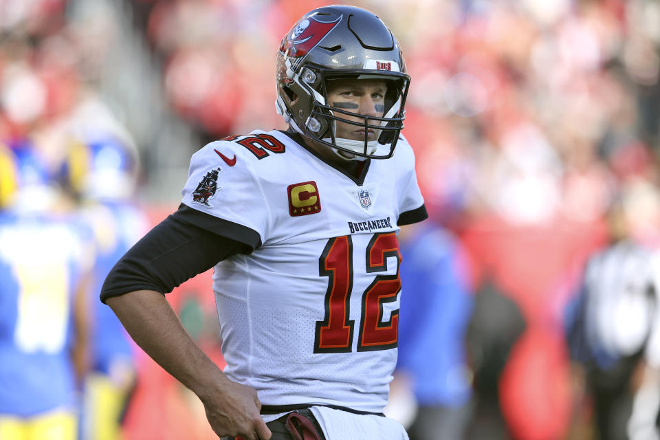 Tampa Bay Buccaneers quarterback Tom Brady (12) reacts after being penalized during the first half of an NFL divisional round playoff football game against the Los Angeles Rams Sunday, Jan. 23, 2022, in Tampa, Fla. (AP Photo/Mark LoMoglio)