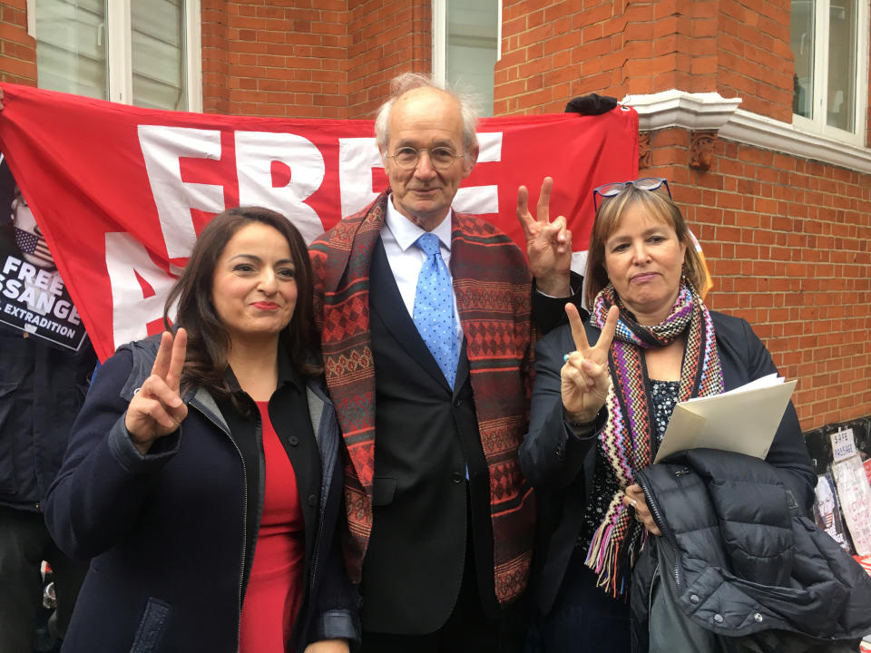 Julian Assange's father John Shipton, poses with German MPs Sevim Dagdelen and Heike Hansel, outside the Ecuadorian embassy in London, Britain, December 20, 2018. REUTERS/Will Russell