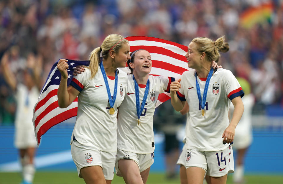 USA's Lindsey Horan (left), Rose Lavelle (centre) and Emily Sonnett during the celebrations after the game. USA v Netherlands - FIFA Women's World Cup 2019 - Final - Stade de Lyon 07-07-2019 . (Photo by  John Walton/EMPICS/PA Images via Getty Images)