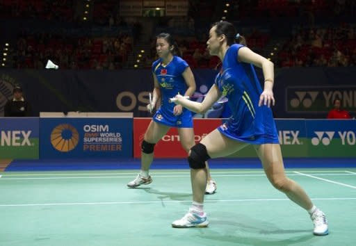Chinese badminton players take on South Korea during the women's doubles semi-finals at the All England Open Badminton Championships in March 2012. Badminton's world body has abandoned plans to force women players to wear skirts, officials said, in the face of fierce opposition which threatened to cause controversy during the Olympics
