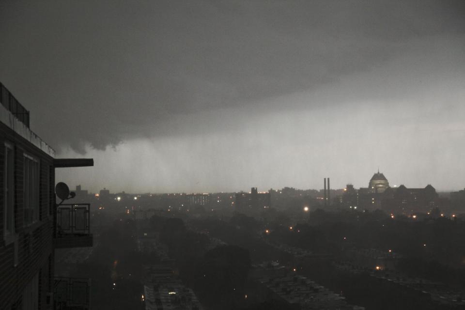 A thunderstorm rolls into the Brooklyn borough of New York on Thursday, July 26, 2012. An outbreak of severe thunderstorms including widespread damaging winds are sweeping over parts of New York with tornado warnings. (AP Photo/Bebeto Matthews)