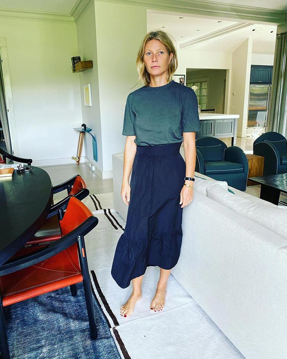 <p>"Home in a skirt for no real reason other than it’s new," the mom of two captioned <a href="https://www.instagram.com/p/CGxmRApD36X/" rel="nofollow noopener" target="_blank" data-ylk="slk:this photo;elm:context_link;itc:0;sec:content-canvas" class="link ">this photo</a> from her sitting room, dressed in a tiered skirt from her Goop colelction. </p>