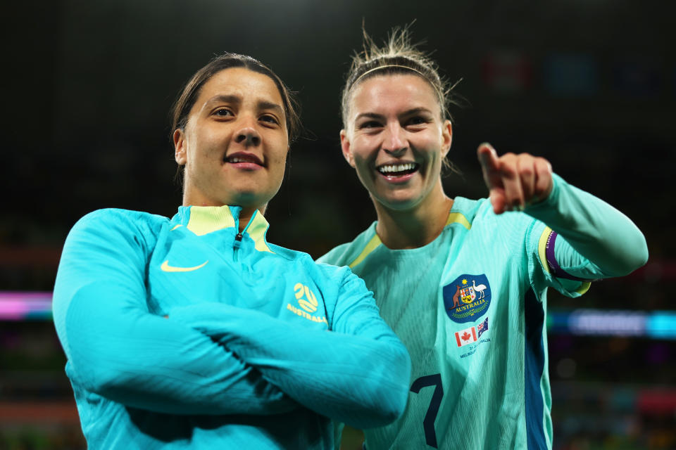 Sam Kerr and Steph Catley smile.