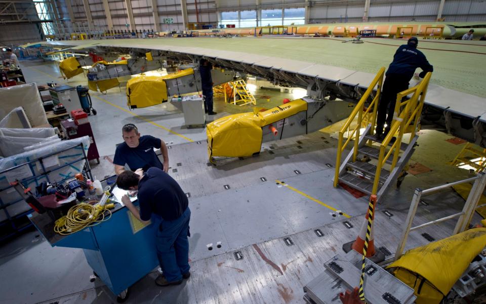 Airbus UK staff building wings at the company's plant in Broughton, north Wales - David Rose