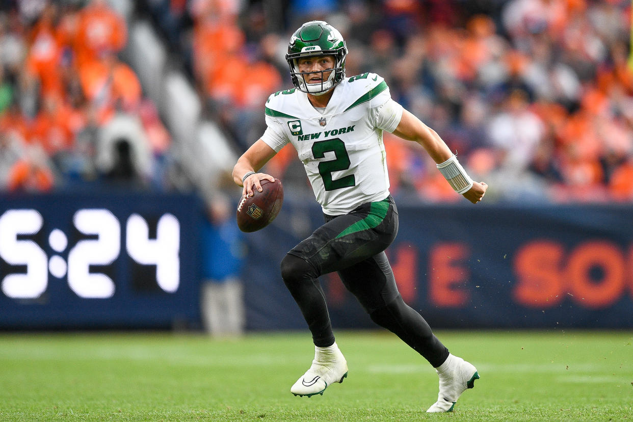 Quarterback Zach Wilson #2 of the New York Jets scrambles against the Denver Broncos in an NFL game