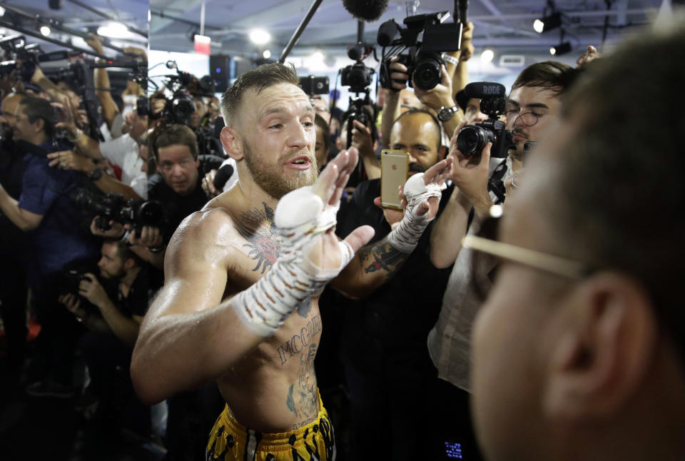 Conor McGregor reacts during a media workout in advance of his fight against Floyd Mayweather Jr. (AP)