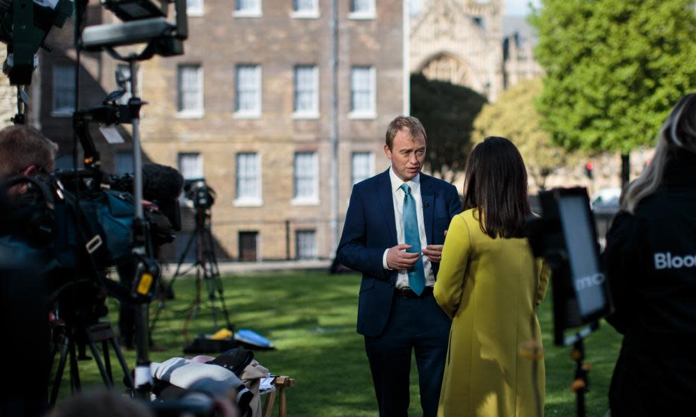 Liberal Democrat Leader Tim Farron (C) gives an interview to media on College Green in Westminster 