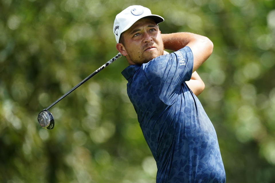 FILE - Xander Schauffele hits off the third tee during the second round of the Tour Championship golf tournament at East Lake Golf Club, Friday, Aug. 26, 2022, in Atlanta. Schauffele will compete on the American team at the Presidents Cup beginning Thursday, Sept. 22. (AP Photo/John Bazemore, File)