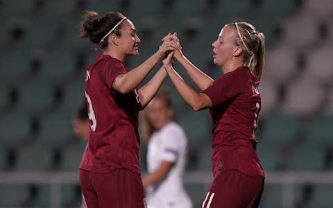 Jodie Taylor and Beth Mead celebrate a goal during a friendly between England and Portugal - Credit: Getty Images