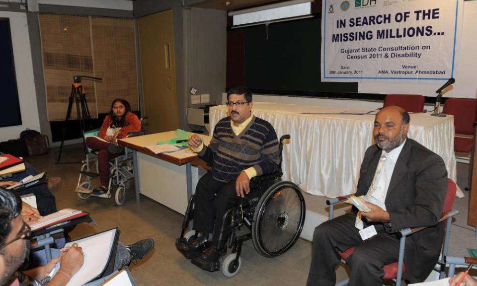 Javed Abidi (centre) in 2011.