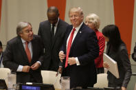 <p>United States President Donald Trump, center, gets up to leave after making a quick statement at a meeting during the United Nations General Assembly at U.N. headquarters, Monday, Sept. 18, 2017. (Photo: Seth Wenig/AP) </p>