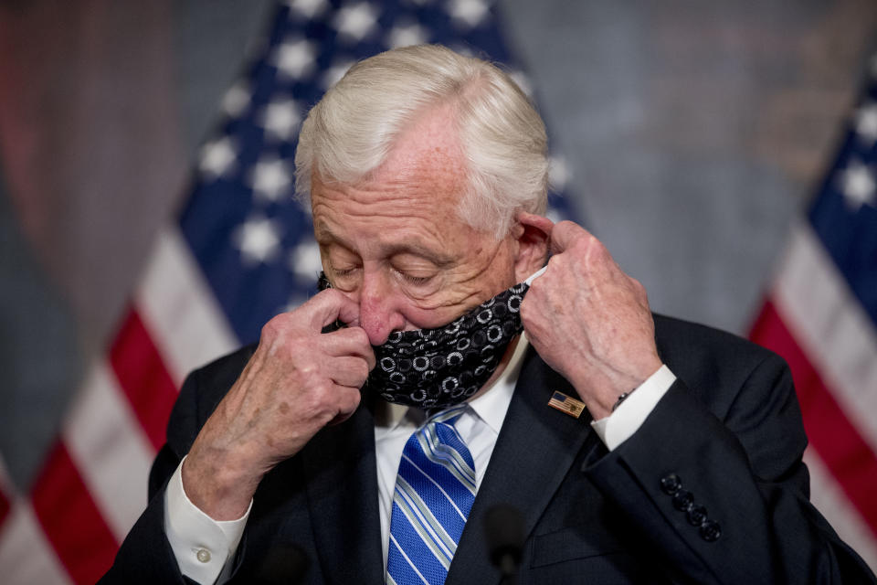 FILE - In this April 23, 2020, file photo, House Majority Leader Steny Hoyer of Md. takes his mask off to speak before the signing ceremony for the Paycheck Protection Program and Health Care Enhancement Act, H.R. 266, after it passed the House on Capitol Hill in Washington. It all started with the grandchildren. As Hoyer saw it, if he could Face Time with his grandkids, why not have Congress legislate by video chat and avoid the health risks of convening at the Capitol during the coronavirus pandemic. (AP Photo/Andrew Harnik, File)