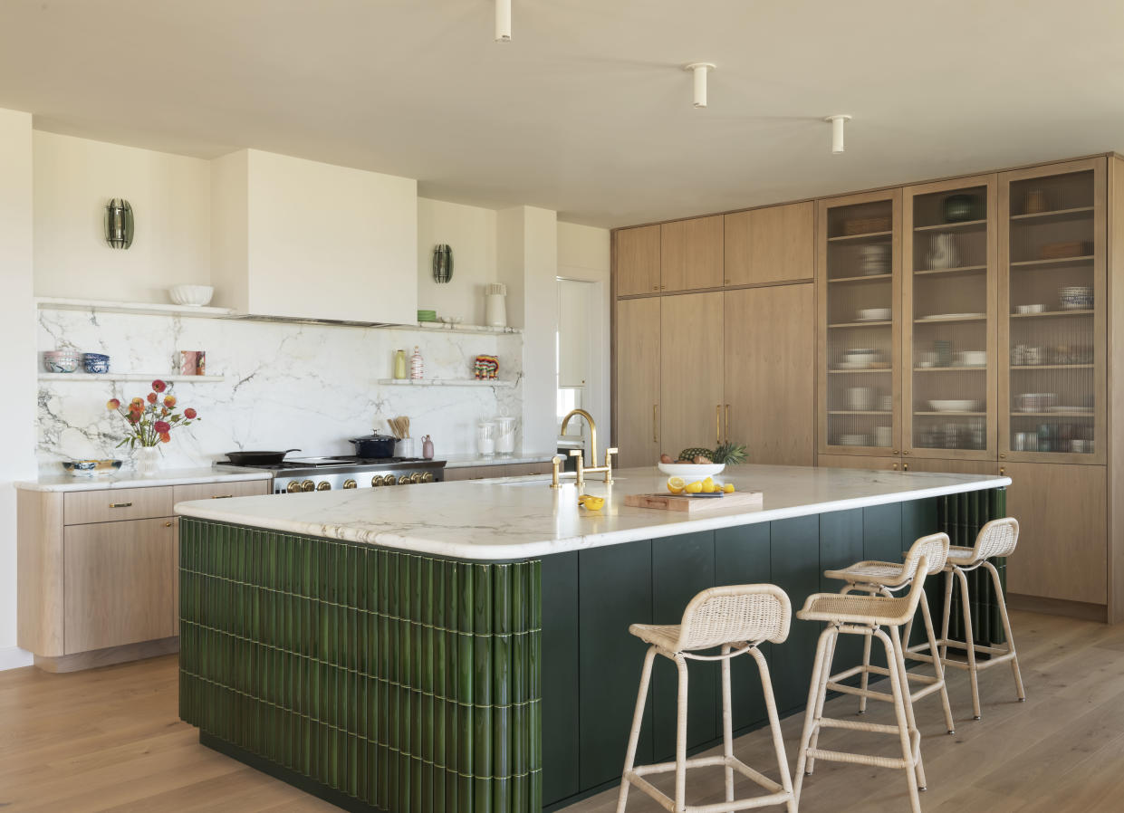  Contemporary kitchen with large green island. 